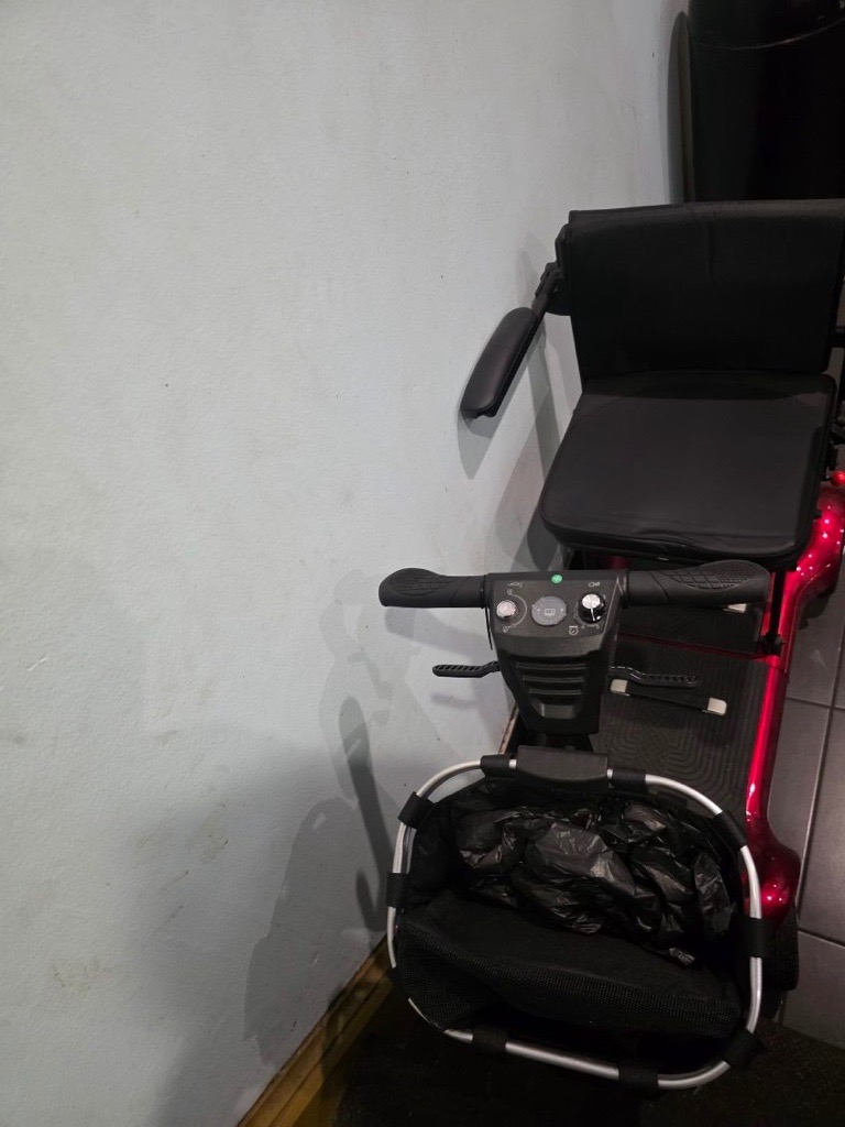 Pre-loved mobility scooter controls and seating close up